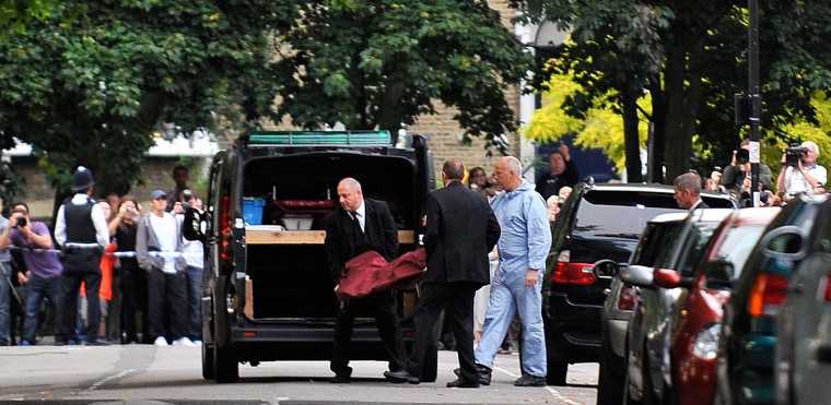 Image: Amy Winehouse's body is carried out of her home